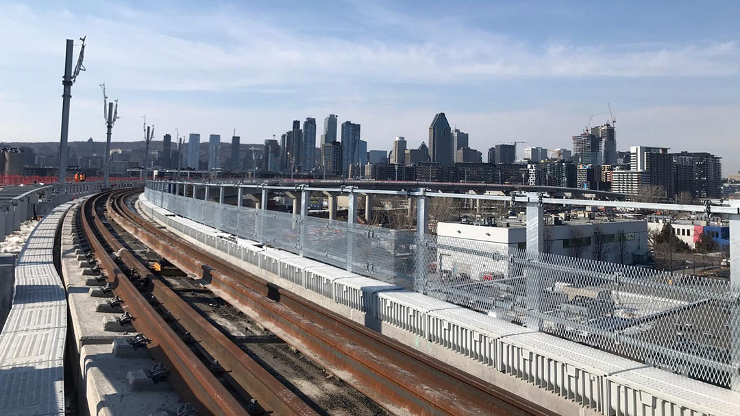 Image of rails installed but not fixed on the route of the Réseau express métropolitain REM