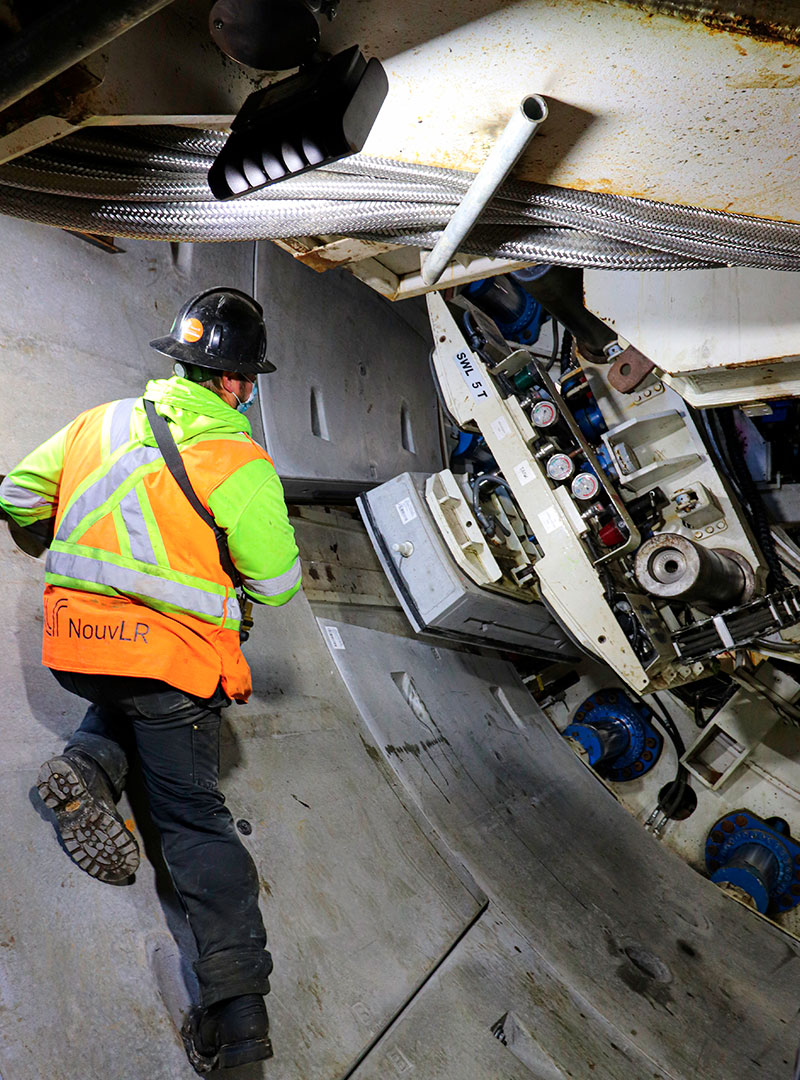 Worker working inside the Alice tunnel boring machine