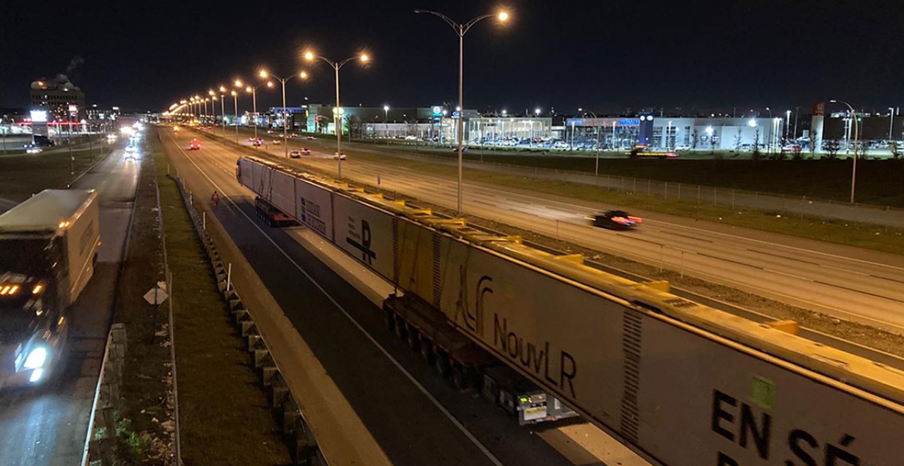 The two beams resumed their journey against the flow of traffic on Highway 40 West to Des Sources Blvd.