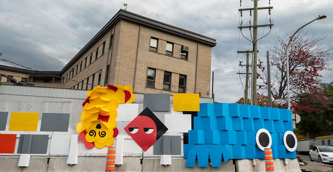 Concept ludique sur les palissades de chantier de la future station Édouard-Montpetit | MASSIVart et La Camaraderie